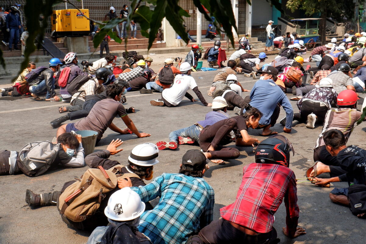 Protesters lie on the ground 