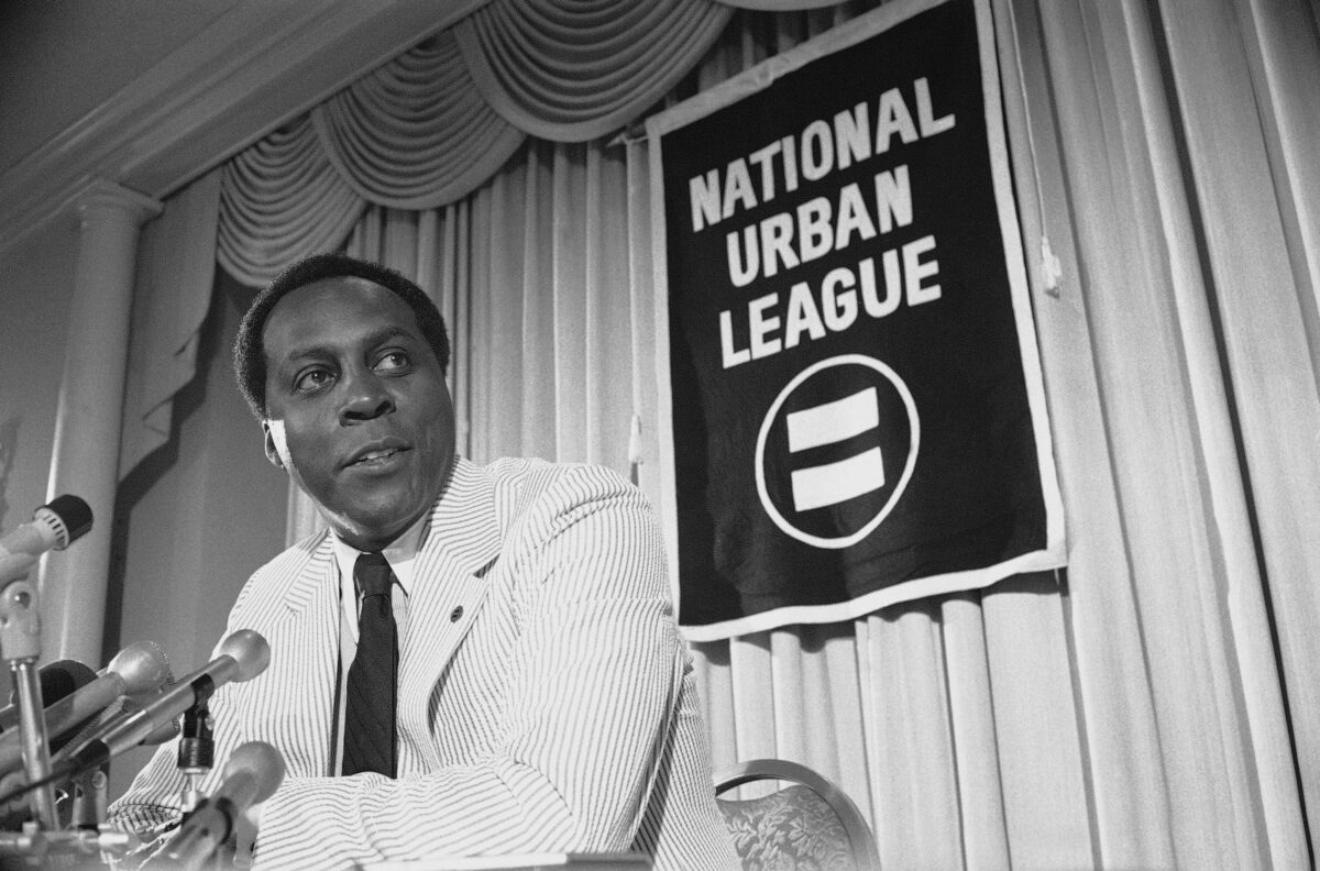 Vernon Jordan talks to reporters