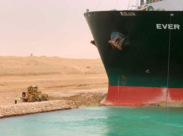 A cargo ship, named the Ever Given, sits with its bow stuck into the wall in Egypt’s Suez Canal, on March 24, 2021. (Suez Canal Authority via AP)