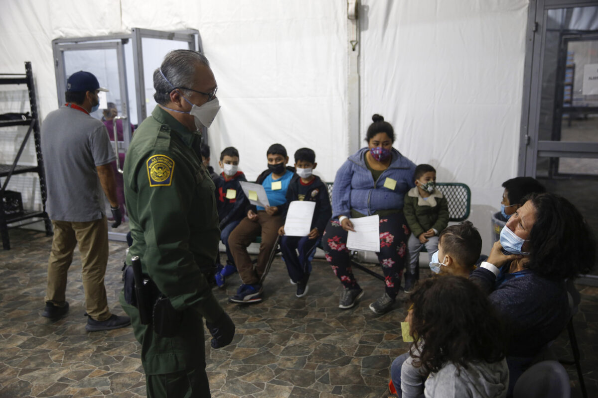 Migrants are processed at the intake area of the U.S. Customs and Border Protection facility, the main detention center for unaccompanied children in the Rio Grande Valley, in Donna, Texas, on March 30, 2021. (Dario Lopez-Mills/AP Photo)