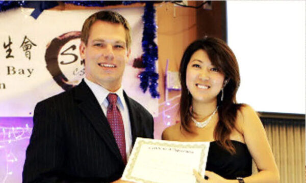 Christine Fang with then-Dublin, Calif., City Council member Eric Swalwell at an October 2012 student event. (Screenshot/Social media)