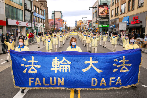 Falun Gong practitioners take part in a parade in Flushing, New York, on April 18, 2021, to commemorate the 22nd anniversary of the April 25th peaceful appeal of 10,000 Falun Gong practitioners in Beijing. (Samira Bouaou/The Epoch Times)