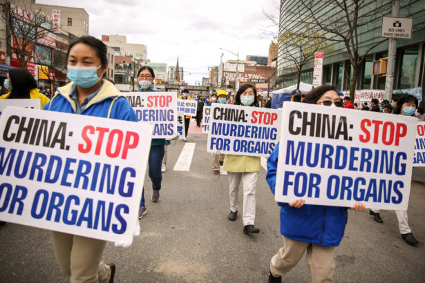 Falun Gong practitioners take part in a parade in Flushing, New York, on April 18, 2021, to commemorate the 22nd anniversary of the April 25th peaceful appeal of 10,000 Falun Gong practitioners in Beijing. (Samira Bouaou/The Epoch Times)