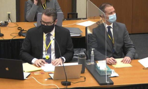 In this image from video, defense attorney Eric Nelson, left, and defendant, former Minneapolis police Officer Derek Chauvin, right, listen as Hennepin County Judge Peter Cahill presides in the trial of Chauvin at the Hennepin County Courthouse in Minneapolis, Minn., on April 8, 2021. (Court TV via AP/Pool)