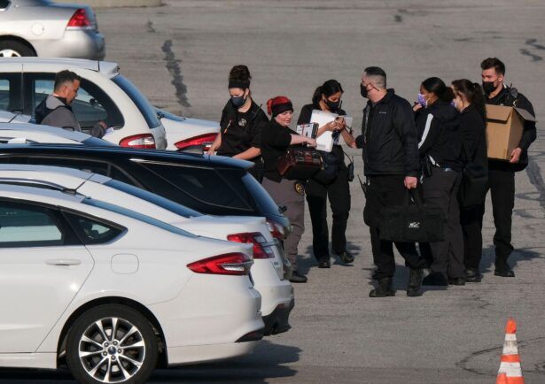 Police and crime scene investigators work at the site of a mass shooting at a FedEx facility in Indianapolis, Ind., on April 16, 2021. (Jeff Dean/AFP via Getty Images)