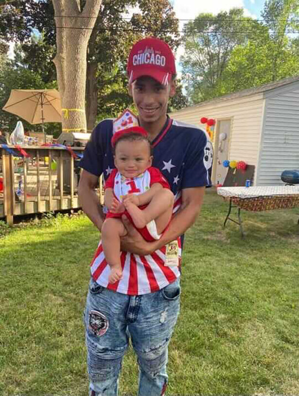 Daunte Wright and his son Daunte Jr., at his first birthday party in a file photo. (Ben Crump Law, PLLC. via AP)