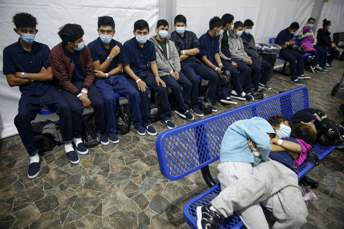 Unaccompanied minors wait for their turn at the secondary processing station inside a holding facility in Donna, Texas, on March 30, 2021. (Dario Lopez-Mills/Pool/AP Photo)