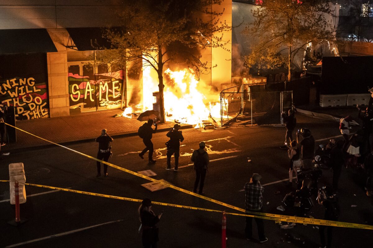 A structure set on fire during a riot burns in Portland, Ore., on April 17, 2021. (Nathan Howard/Getty Images)