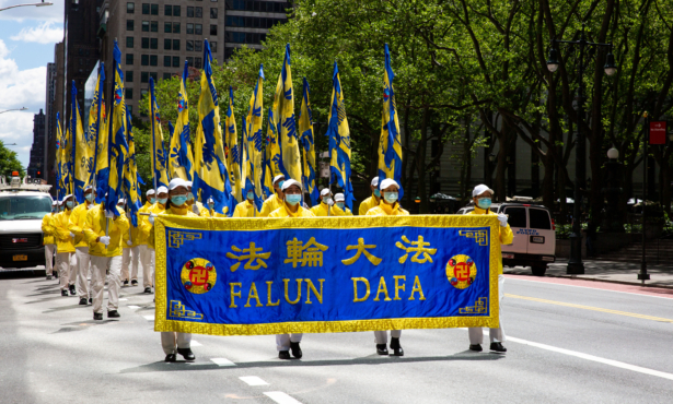Practitioners of the spiritual discipline Falun Gong hold a parade in New York City on May 13, 2021. (Chung I Ho/The Epoch Times)