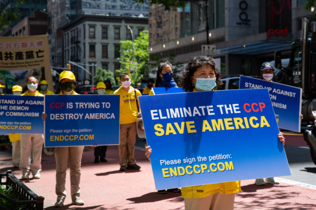 Practitioners of the spiritual discipline Falun Gong hold a parade in New York City on May 13, 2021. (Chung I Ho/The Epoch Times)