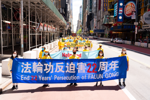 Practitioners of the spiritual discipline Falun Gong hold a parade in New York City on May 13, 2021. (Larry Dai/The Epoch Times)