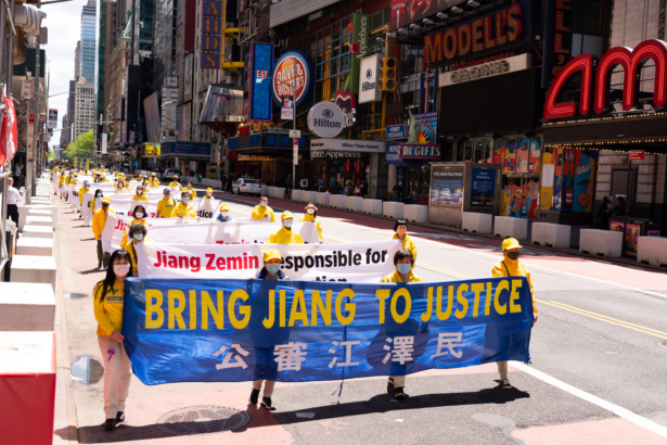 Practitioners of the spiritual discipline Falun Gong hold a parade in New York City on May 13, 2021. (Larry Dai/The Epoch Times)