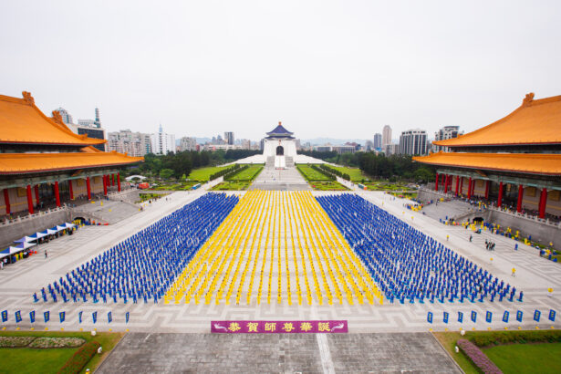 Falun Gong adherents take part in a joint exercise in Taipei, Taiwan, on May 1, 2021. (Chen Po-chou/The Epoch Times)