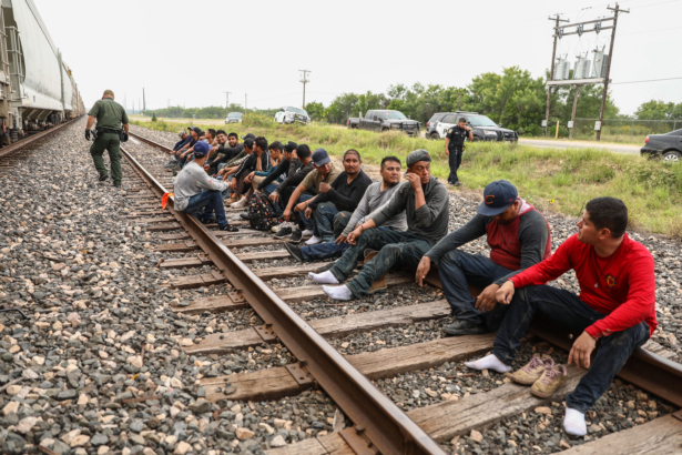 Border Patrol agents apprehend 21 illegal aliens from Mexico who had hidden in a grain hopper on a freight train heading to San Antonio, near Uvalde, Texas, on June 21, 2021. (Charlotte Cuthbertson/The Epoch Times)