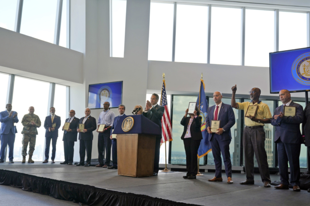 New York Gov. Andrew Cuomo, center, applauds with others as representatives for various essential jobs receive plaques to recognize their work during the pandemic during a news conference at One World Trade in New York, Tuesday, June 15, 2021. (Seth Wenig/AP Photo)