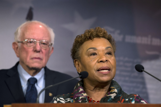 Rep. Barbara Lee (D-Calif.), flanked by Sen. Bernie Sanders, (I-Vt.), speaks during a news conference on a measure limiting President Donald Trump's ability to take military action against Iran, on Capitol Hill, in Washington, on Jan. 9, 2020. (Jose Luis Magana/AP Photo)
