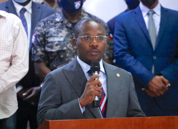 Haiti's interim Prime Minister Claude Joseph addresses the audience after suspects in the assassination of President Jovenel Moise, were shown to the media, in Port-au-Prince, Haiti July 8, 2021. (Estailove St-Val/Reuters)