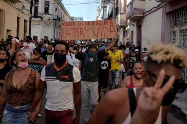 People shout slogans against the government during a protest in Havana, Cuba, on July 11, 2021. (Alexandre Meneghini/Reuters)