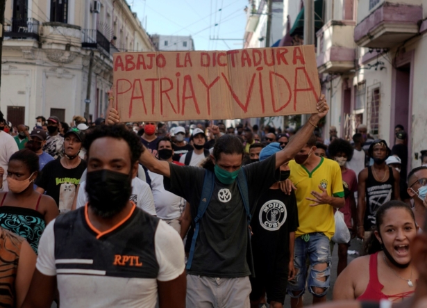 People shout slogans against the communist regime during a protest in Havana, Cuba, on July 11, 2021. (Alexandre Meneghini/Reuters)