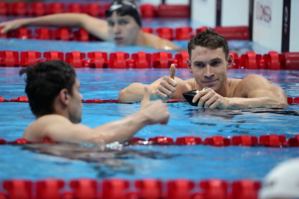The United States' Ryan Murphy (R) gives a thumbs up to Evgeny Rylov, of Russian Olympic Committee, after Rylov won the men's 200-meter backstroke final at the 2020 Summer Olympics in Tokyo, Japan, on July 30, 2021. (David Goldman/AP Photo)