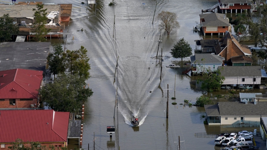 Rescuers on Boats Reach Those Stranded by Ida