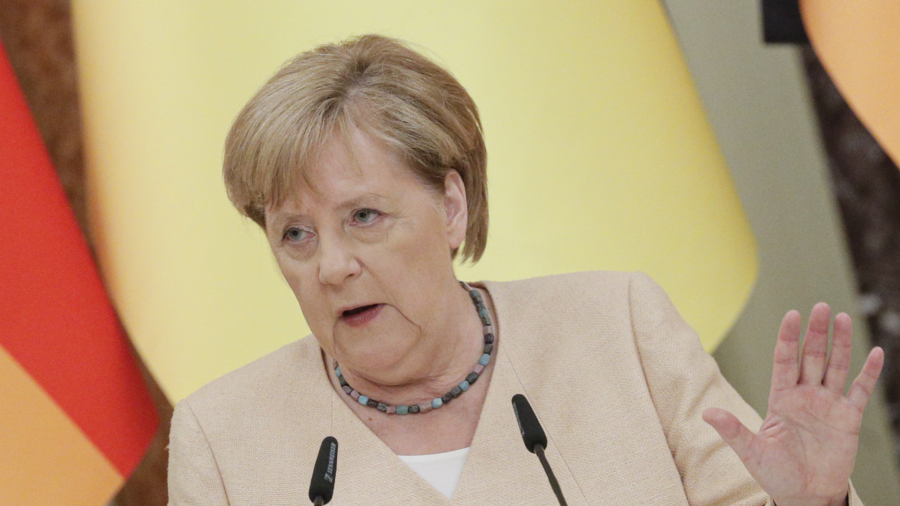 Chinese Leader Xi Jinping Speaks With German Chancellor Angela Merkel
