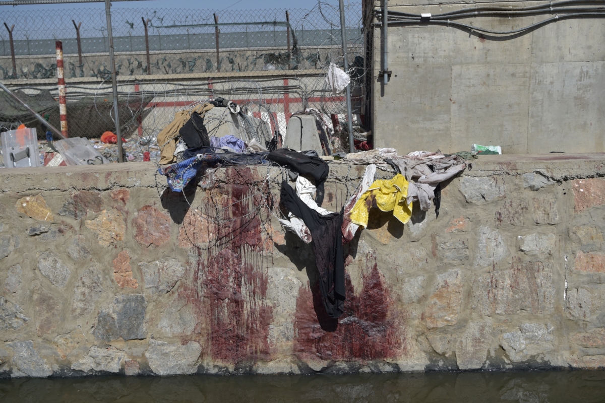 Clothes and blood stains of Afghan people who were waiting to be evacuated are seen at the Kabul, Afghanistan, airport on Aug. 27, 2021. (Wakil Kohsar/AFP via Getty Images)