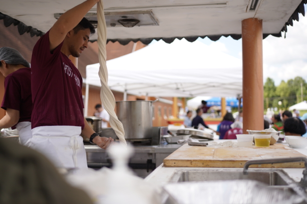 Chef making noodles during Mid-Autumn festival in New Century Film, at Port Jervis, N.Y., on Sep 18, 2021. (Enrico Trigoso/The Epoch Times)