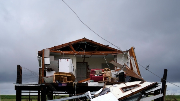 Storm clouds from Tropical Storm Nicholas are seen behind a home that was destroyed by Hurricane Ida, in Pointe-aux-Chenes, La., on Sept. 14, 2021. (Gerald Herbert/AP Photo)