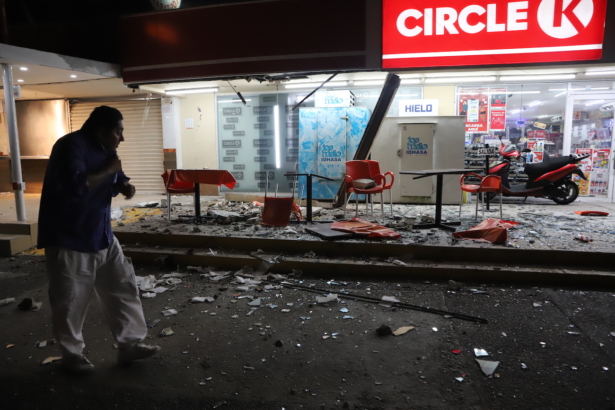 A man walks in from of a convenience store on a street covered with debris after a strong earthquake, in Acapulco, Mexico, on Sept. 7, 2021. (Bernardino Hernandez/AP Photo)