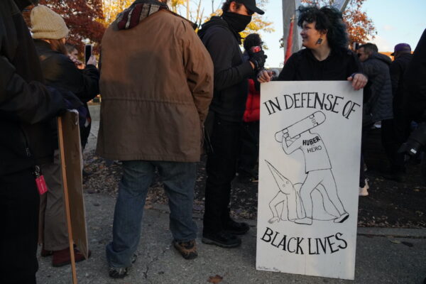 A homemade poster honoring Kyle Rittenhouse's attacker, Anthony Huber, displayed at a protest in Kenosha, Wis., on Nov. 21, 2021. (Jackson Elliott/The Epoch Times)