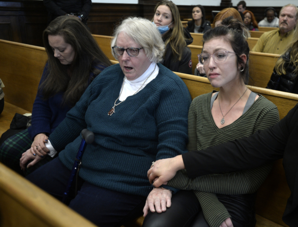 (L–R) Kariann Swart, Joseph Rosenbaum's fiancee, Susan Hughes, Anthony Huber's great aunt, and Hannah Gittings, Anthony Huber's girlfriend, listen as Kyle Rittenhouse is found not guilty on all counts at the Kenosha County Courthouse in Kenosha, Wis., on Nov. 19, 2021. (Sean Krajacic/Pool/The Kenosha News via AP)