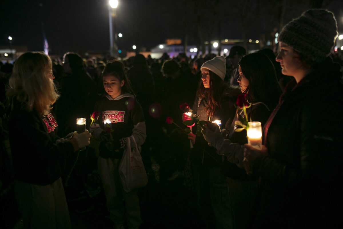 People hold candles during a vigil in Cutler Park in Waukesha, Wis., on Nov. 22, 2021. (Jim Vondruska/Getty Images)