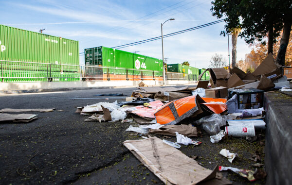 Empty boxes lay scattered near the railroad tracks after ongoing train robberies in the Lincoln Heights neighborhood of Los Angeles on Jan. 14, 2022. (John Fredricks/The Epoch Times)