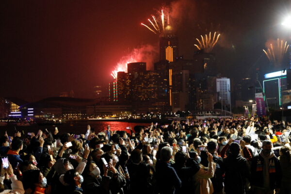 Fireworks explode over skyline building to celebrate New Year in Hong Kong, China, Jan. 1, 2022. (Tyrone Siu/Reuters)