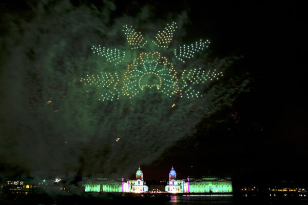 Fireworks and a drone light show are seen over the Old Royal Naval College in Greenwich to bring in the New Year in London, England, on Jan. 1, 2022. (Rob Pinney/Getty Images)
