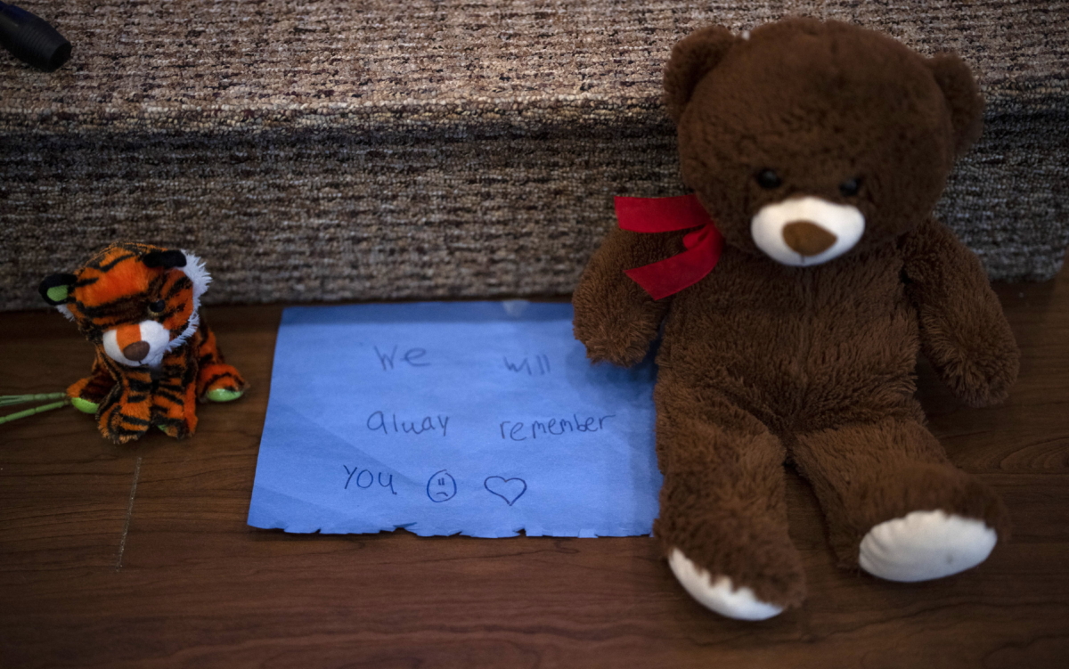 Stuffed animals are left at the altar during a prayer vigil for 10-year-old Iliana "Lily" Peters at Valley Vineyard Church in Chippewa Falls, Wis., on April 25, 2022. (Jeff Wheeler/Star Tribune via AP)