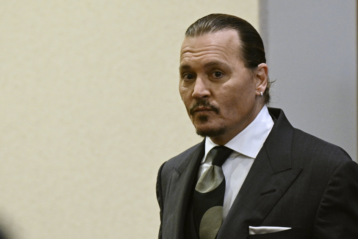 Actor Johnny Depp arrives in the courtroom at the Fairfax County Circuit Court in Fairfax, Va., on April 26, 2022. (Brendan Smialowski/Pool Photo via AP)