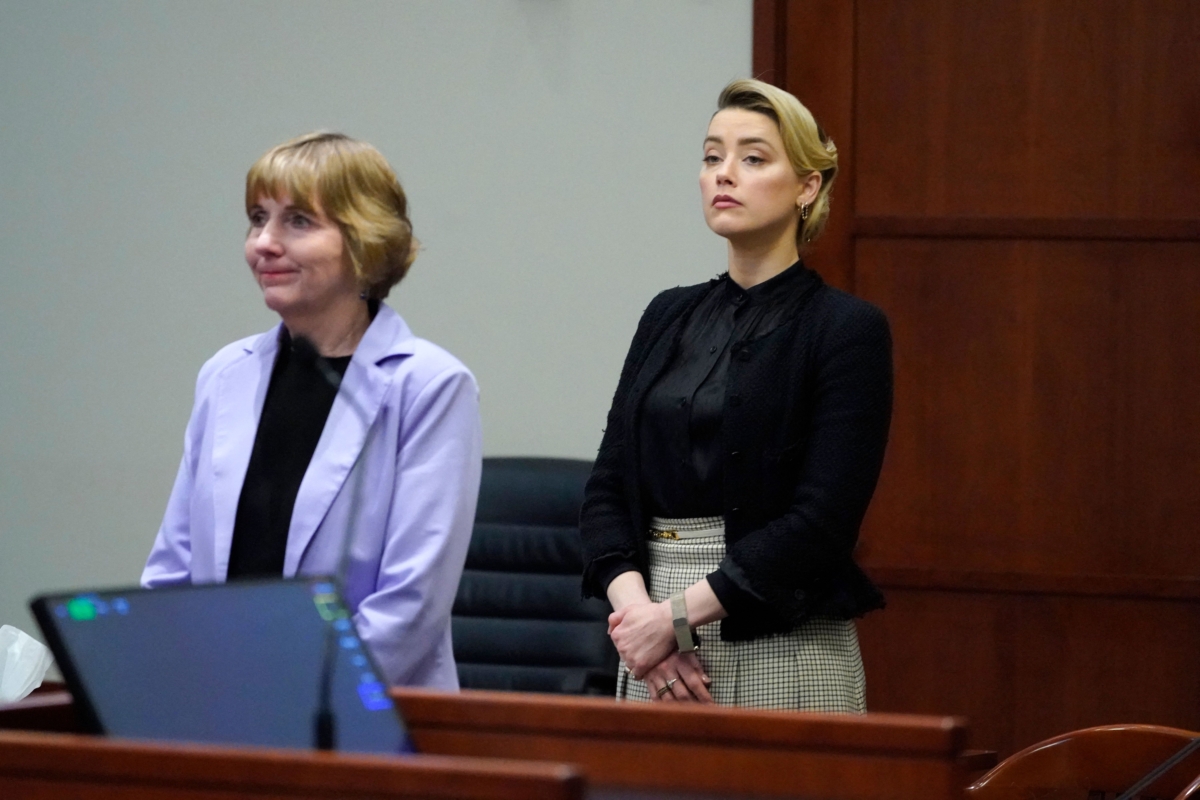 Actress Amber Heard (R) and her Attorney Elaine Bredehof listen in the courtroom at the Fairfax County Circuit Courthouse in Fairfax, Va., on April 25, 2022. (Steve Helber/Pool/AFP via Getty Images)