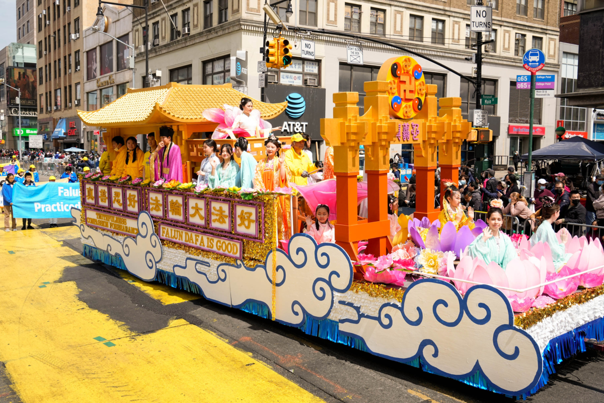 Falun Gong practitioners participate in a parade to commemorate the 23rd anniversary of the April 25th peaceful appeal in Beijing, in Flushing, New York, on April 23, 2022. (Larry Dye/The Epoch Times)