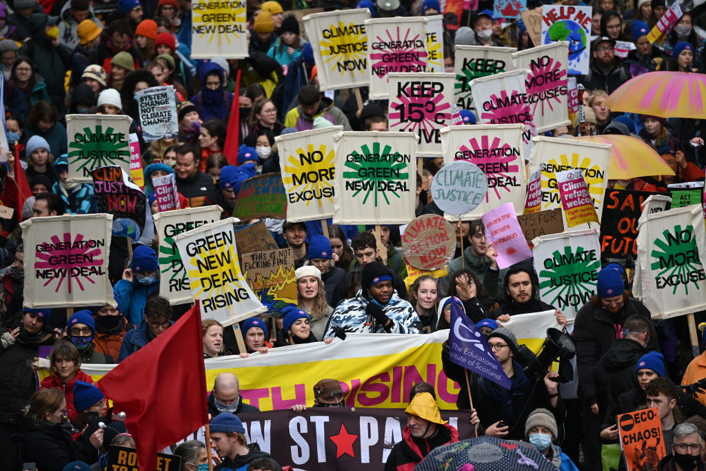 Climate protestors gather for the Global Day of Action for Climate Justice march in Glasgow, Scotland, on Nov. 6, 2021—Day 7 of the 2021 climate summit in Glasgow. (Jeff J Mitchell/Getty Images)
