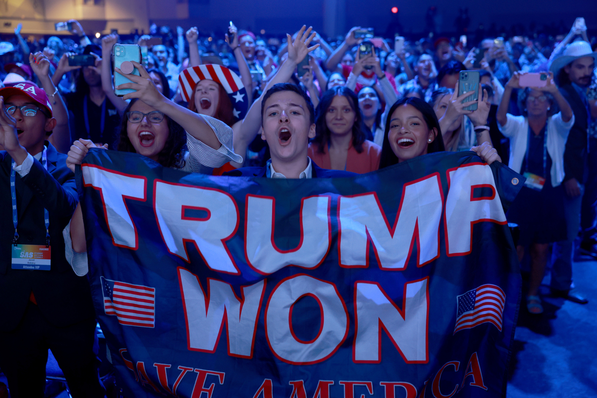 Young supporters cheer as former President Donald Trump arrives on stage during the Turning Point USA Student Action Summit held at the Tampa Convention Center in Tampa, Fla., on July 23, 2022. (Joe Raedle/Getty Images)