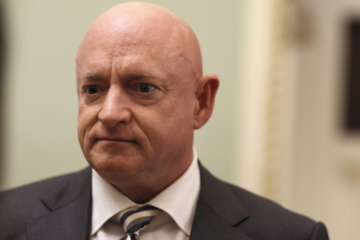 Sen. Mark Kelly (D-Ariz.) speaks with a journalist before going to a luncheon with Senate Democrats in Washington on June 14, 2022. (Photo by Anna Moneymaker/Getty Images)
