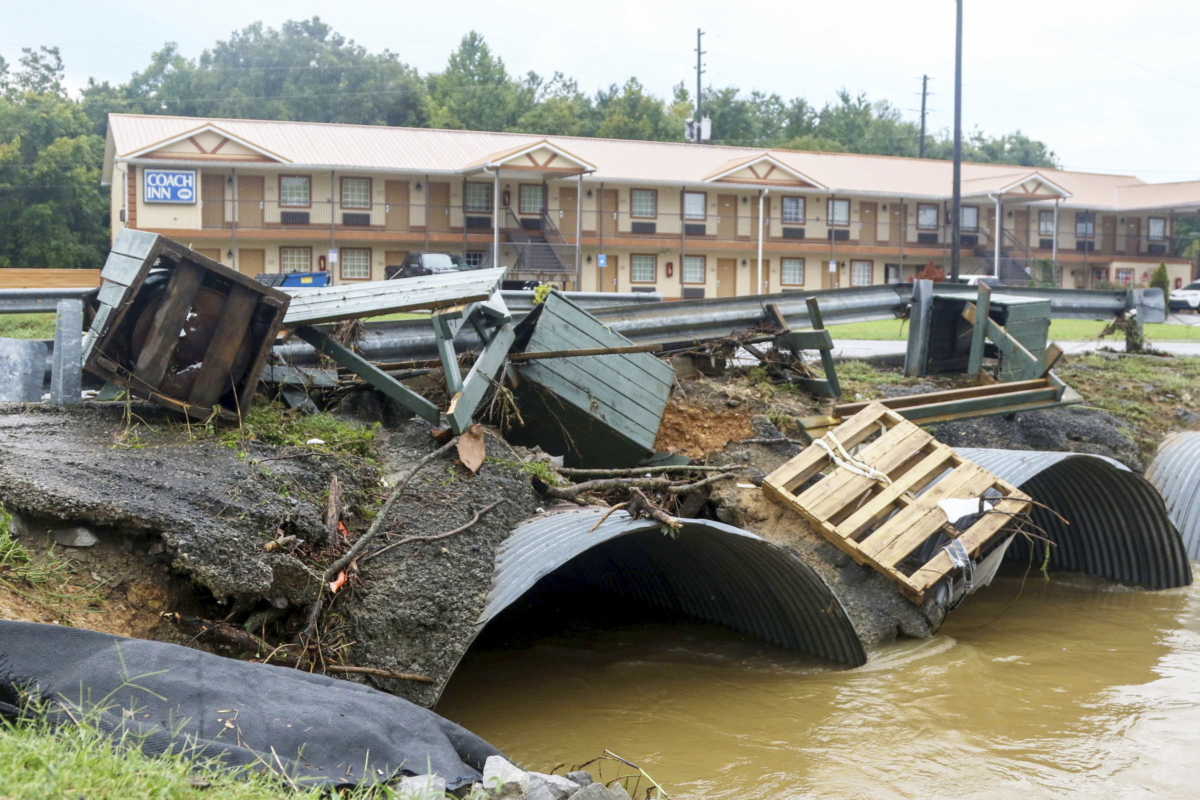 Trash cans from JR Dick Dowdy Park wash up outside of the Coach Inn in Summerville, Ga., on Sept. 4, 2022. (Olivia Ross/Chattanooga Times Free Press via AP)