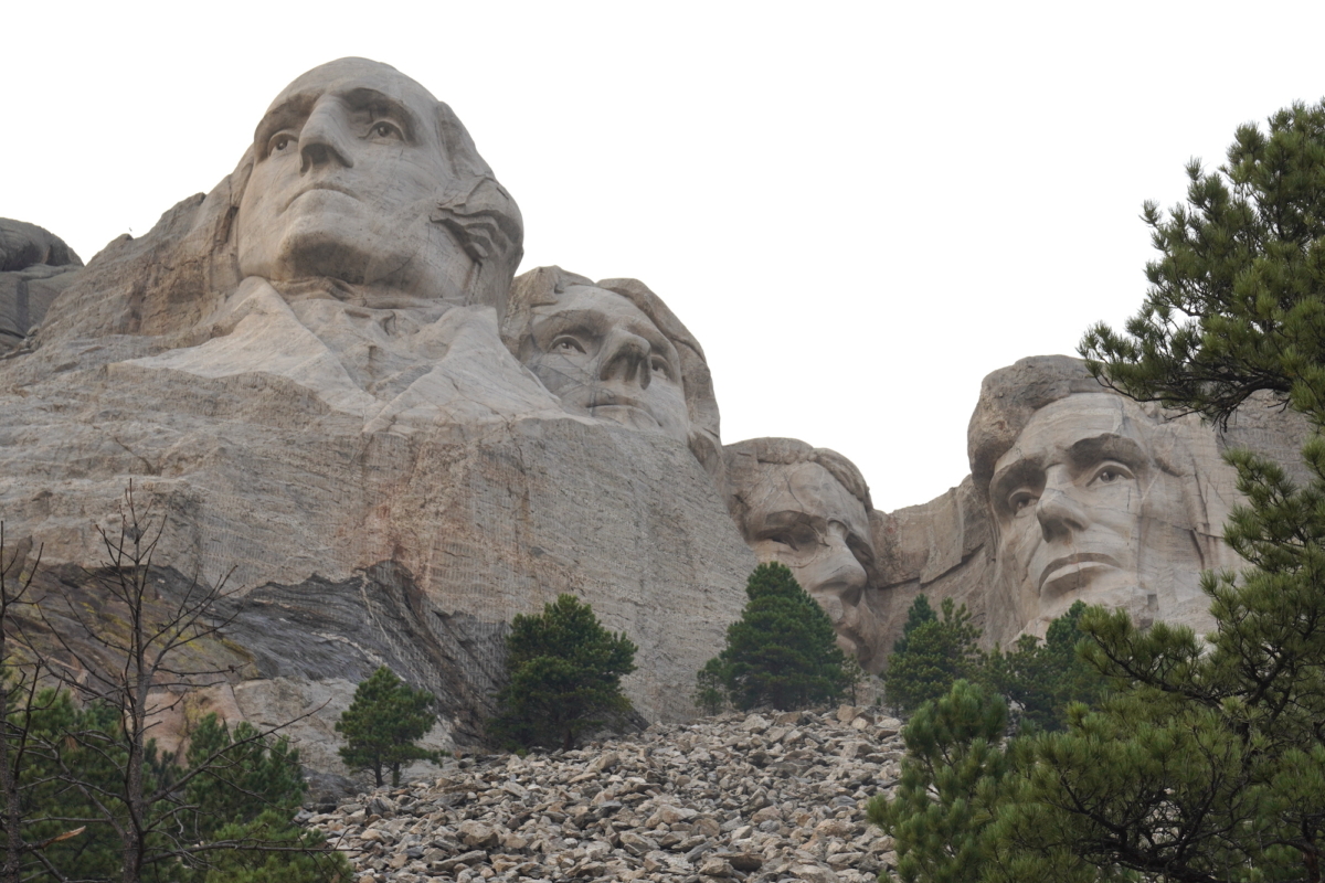 Mount Rushmore as seen from below on a trail leading up to the base of the monument in Keystone, S.D., on Sept. 7, 2022. (Allan Stein/The Epoch Times)