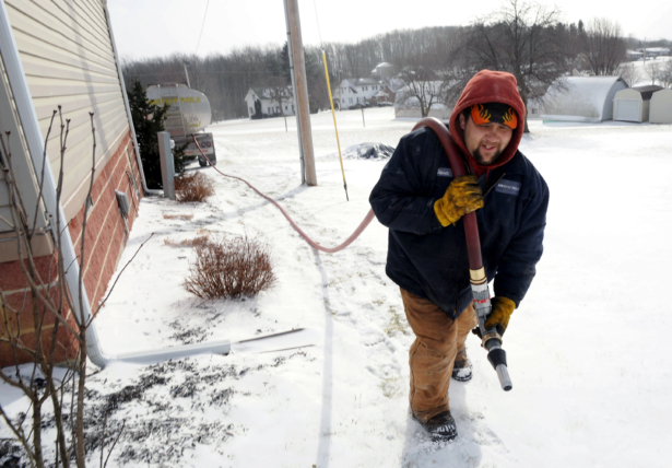 Denver Walker, of Somerset Fuels, makes a heating oil delivery to a home in Jenner Crossroads, Pa., on Jan. 7, 2014. (John Rucosky/AP Photo via Tribune-Democrat)