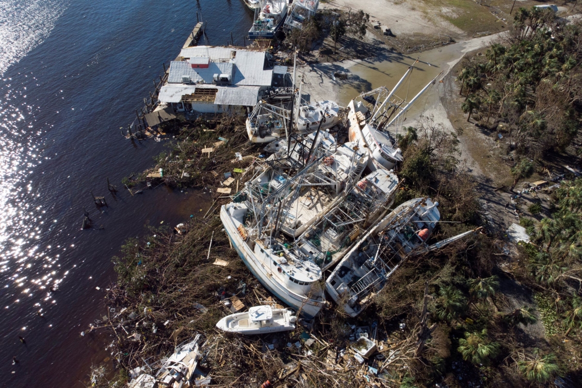 Stranded shrimp boats are seen in a marina